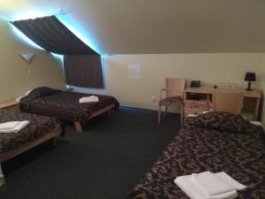 Giường trong phòng chung tại Alex Hotel