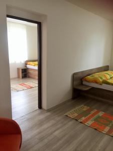 Postel nebo postele na pokoji v ubytování Promenád apartmány