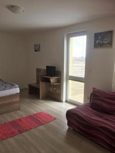 Postel nebo postele na pokoji v ubytování Promenád apartmány