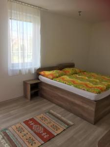 Postel nebo postele na pokoji v ubytování Promenád apartmány