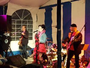 a group of people on a stage with instruments at Camping Au Bois Dormant in Chauffour-sur-Vell +35 photos