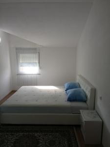 Ένα ή περισσότερα κρεβάτια σε δωμάτιο στο Apartments Aldi +49 φωτογραφίες