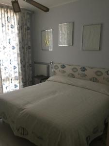 Cama ou camas em um quarto em Marina Capo Pino