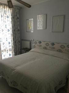 A bed or beds in a room at Marina Capo Pino