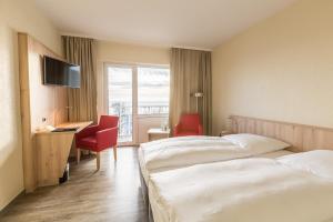 Rúm í herbergi á Rügen-Hotel