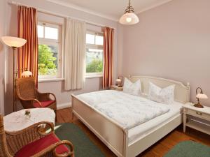 Säng eller sängar i ett rum på Hotel Villa Caldera