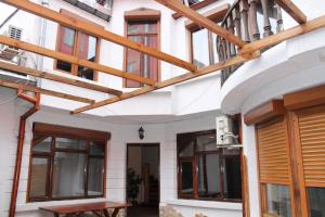 a building with wooden beams on the facade at Family Hotel Square in Ruse