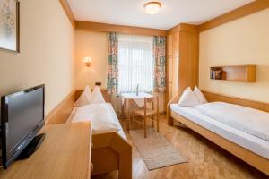 מיטה או מיטות בחדר ב-Gasthof Siegfried Gruber