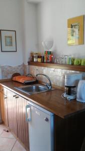 a kitchen with a sink and a counter top at Kortiri Studios in Ayios Nikolaos Sithonia