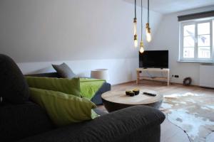 a living room with a couch and a coffee table at Feriendomizil Dinkelsbühl in Dinkelsbühl