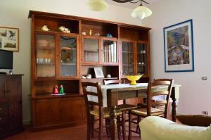 a dining room with a table and some chairs at Le ginestre in San Severino Marche