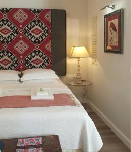 Postel nebo postele na pokoji v ubytování Artizan Liston Suites