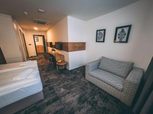 Krevet ili kreveti u jedinici u objektu Orange Hotel