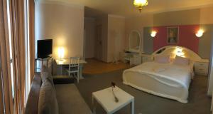 Postel nebo postele na pokoji v ubytování Hotel Passione