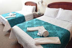 Postel nebo postele na pokoji v ubytování Hotel Makroz