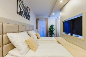 Кровать или кровати в номере Zigzak Apartments Superior 10A