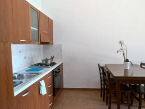 Kuchyň nebo kuchyňský kout v ubytování Le colonie