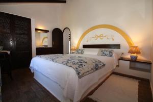 En eller flere senge i et værelse på Quinta do Caracol