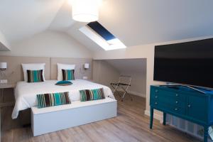 Cama o camas de una habitación en Auberge des Grands Bois