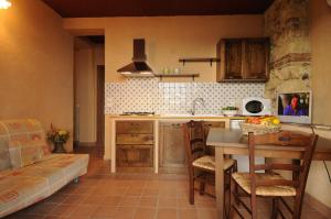 Kuchyň nebo kuchyňský kout v ubytování Residence Casa Torretta