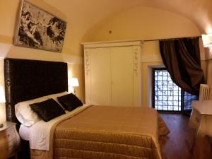 Posteľ alebo postele v izbe v ubytovaní Castello Izzalini Todi Resort