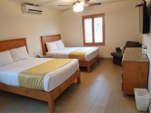 Postel nebo postele na pokoji v ubytování Hotel Quinta