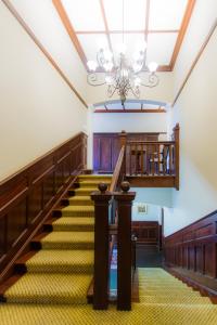 
a long row of stairs leading up to a staircase at Audacia Manor Boutique Hotel in Durban
