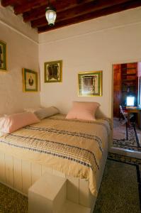 Säng eller sängar i ett rum på Villa Melenos Lindos