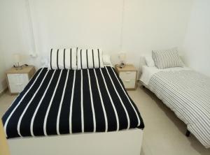 Un ou plusieurs lits dans un hébergement de l'établissement Casa Carmen Barcelona