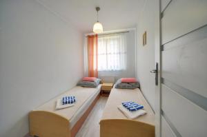 Posteľ alebo postele v izbe v ubytovaní Apartamenty "MILENA"