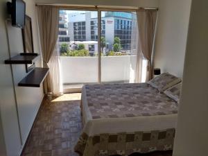 Khu vực ghế ngồi tại Apartamento cerca del mar en Viña del mar