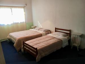 Cama o camas de una habitación en Casa en colonia para 7 personas