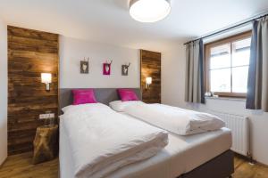 Katil atau katil-katil dalam bilik di Chalet im Dorf
