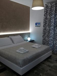 Postel nebo postele na pokoji v ubytování La Suite Negli Orti