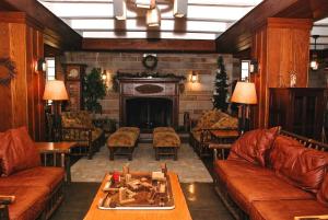 a living room filled with furniture and a fireplace at Spring Mill Inn in Mitchell