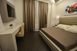 Petit Hotel Elita客房内的一张或多张床位