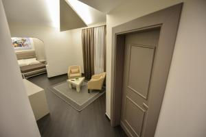 Petit Hotel Elita客房内的一张或多张床位