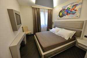 Petit Hotel Elita客房内的一张或多张床位