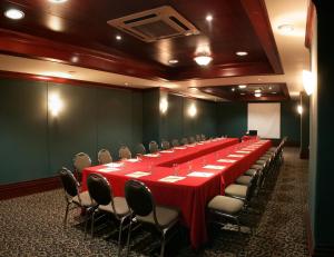 a large conference room with a long table and chairs at Hotel Santa Anita a Balderrama Hotel Collection in Los Mochis