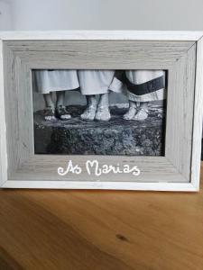 a picture of people standing in a picture frame at Casa das Marias in Horta