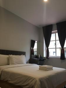Cama o camas de una habitación en Hotel Intan Jugra