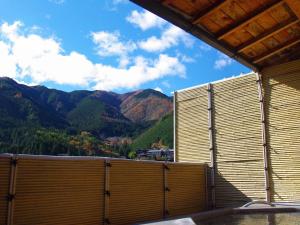 a view of the mountains from a building at Gero Onsen Fugaku in Gero