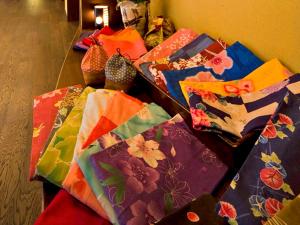 a group of colorful bags sitting on a table at Gero Onsen Fugaku in Gero