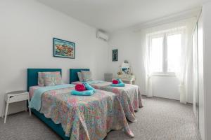 Posteľ alebo postele v izbe v ubytovaní Apartment KAPO