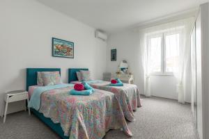 Posteľ alebo postele v izbe v ubytovaní Apartment KAPO