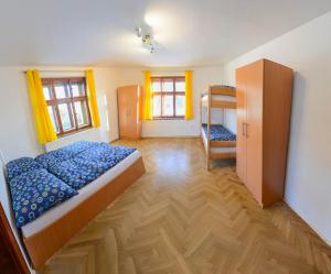 Postel nebo postele na pokoji v ubytování Apartmány pod klášterem