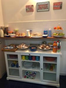 a kitchen counter with dishes and food on it at Oasis in Acitrezza
