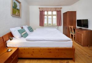 Voodi või voodid majutusasutuse Wellness Hotel Florián České Žleby toas