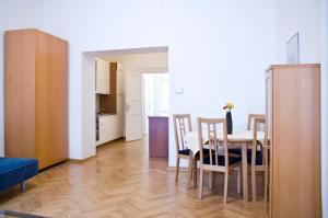 a kitchen and dining room with a table and chairs at Ai Quattro Angeli in Prague