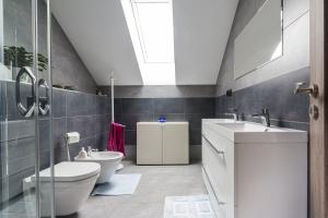 a bathroom with a toilet and a sink at Casa Spas in Banská Bystrica +38 photos